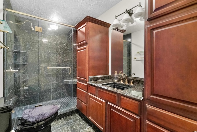 full bathroom with recessed lighting, a textured ceiling, a shower stall, and vanity