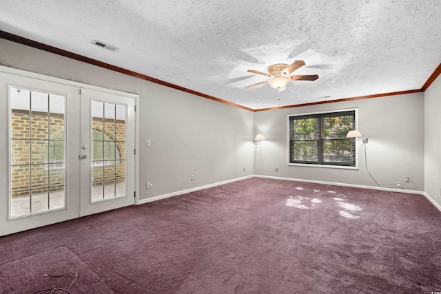 carpeted empty room with french doors, a ceiling fan, baseboards, visible vents, and ornamental molding