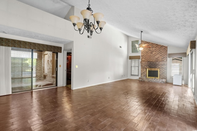 unfurnished living room featuring a textured ceiling, visible vents, wood finished floors, high vaulted ceiling, and ceiling fan with notable chandelier
