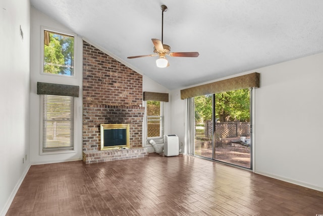 unfurnished living room with plenty of natural light, ceiling fan, and lofted ceiling