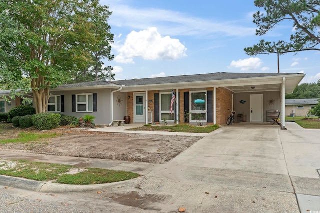 ranch-style home with a porch and a carport