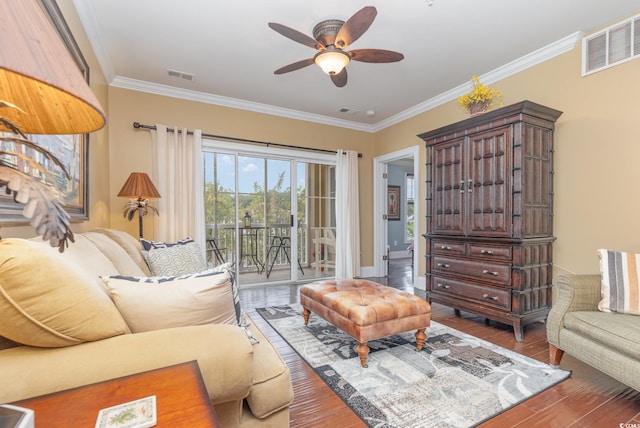 living room featuring ornamental molding, ceiling fan, and hardwood / wood-style flooring