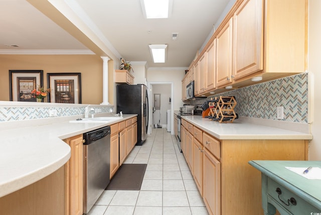 kitchen featuring light brown cabinets, backsplash, appliances with stainless steel finishes, crown molding, and ornate columns