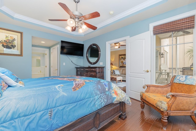 bedroom featuring crown molding, a tray ceiling, hardwood / wood-style floors, and ceiling fan