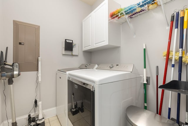 laundry room with cabinets, light tile patterned floors, electric panel, and independent washer and dryer