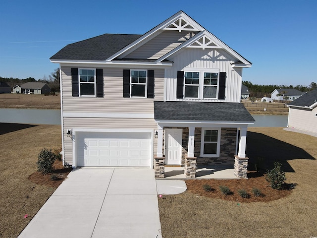 craftsman house featuring concrete driveway, a shingled roof, an attached garage, and stone siding