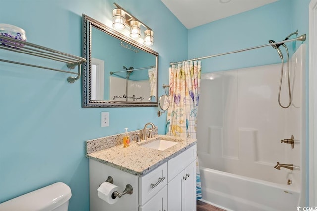 full bathroom with hardwood / wood-style floors, shower / bath combo, vanity, and toilet