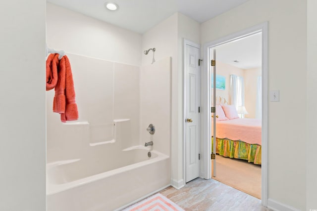 bathroom with bathing tub / shower combination