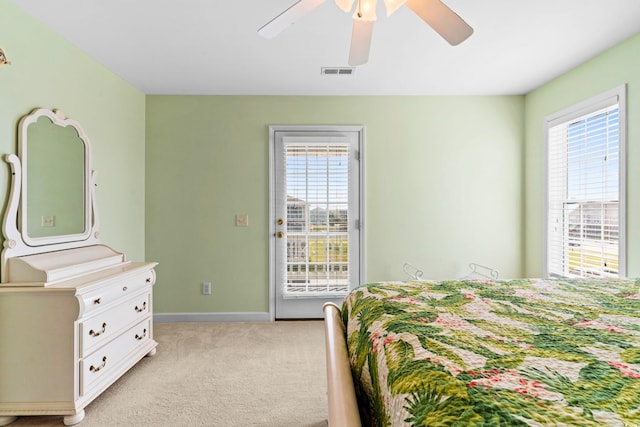 bedroom with light carpet and ceiling fan