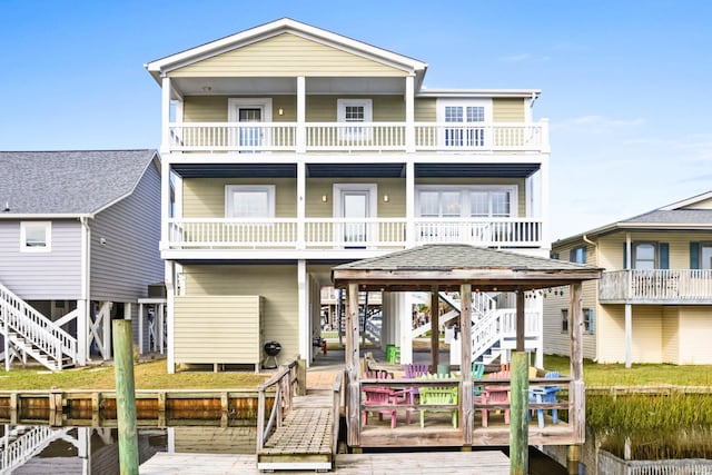 rear view of property with a balcony