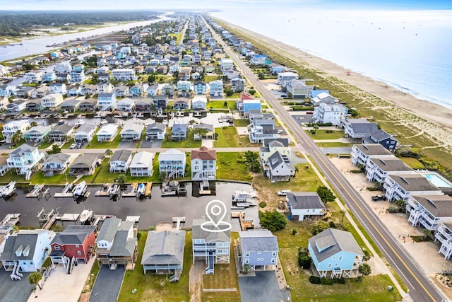 aerial view featuring a water view and a beach view