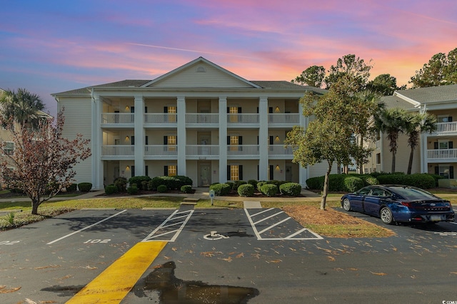 view of outdoor building at dusk