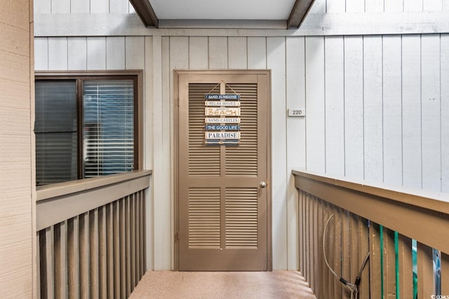 interior details with wood walls and carpet