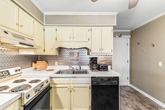 kitchen with white electric range, black dishwasher, wood walls, and cream cabinets