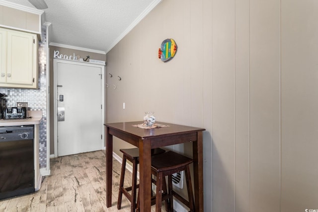 kitchen with dishwasher, wooden walls, light hardwood / wood-style flooring, backsplash, and ornamental molding