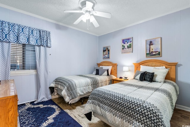 bedroom featuring ceiling fan, hardwood / wood-style flooring, a textured ceiling, and crown molding