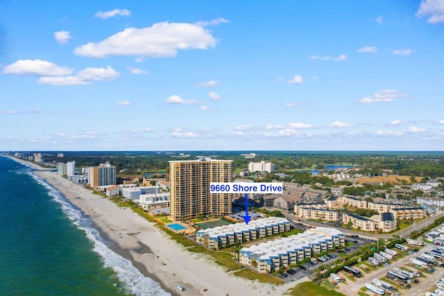 aerial view featuring a water view and a beach view