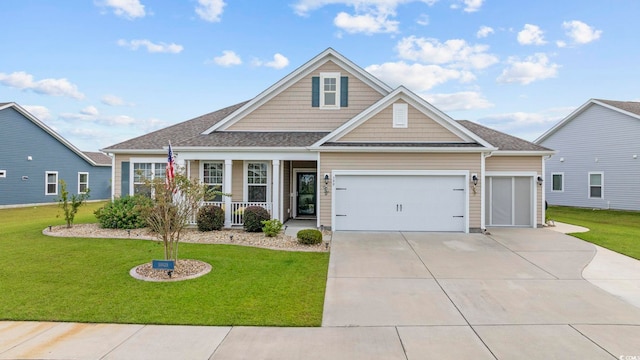 craftsman-style house featuring a garage, a front lawn, and a porch