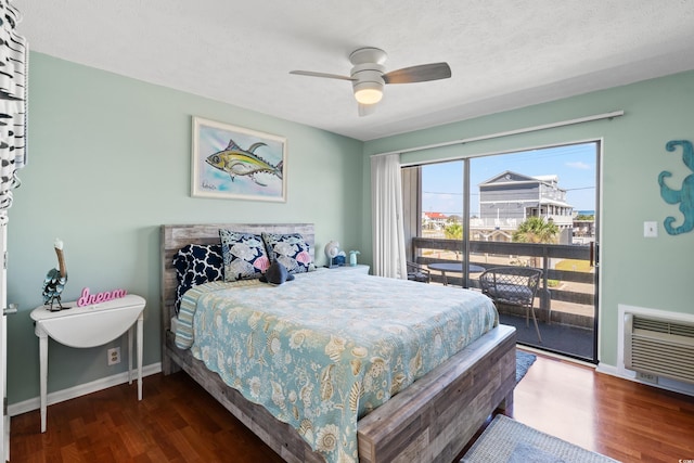 bedroom featuring a textured ceiling, dark wood-type flooring, and ceiling fan