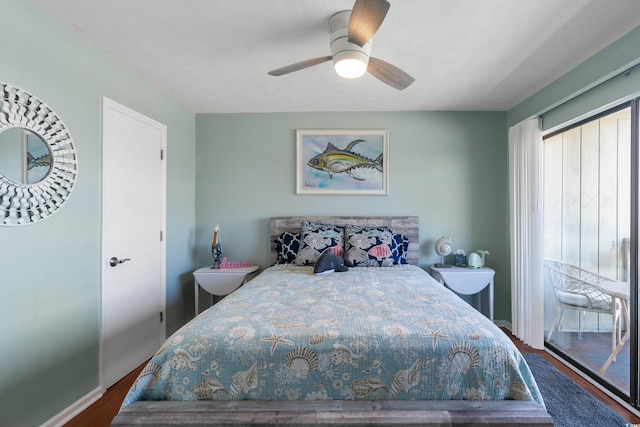 bedroom with access to outside, hardwood / wood-style floors, and ceiling fan