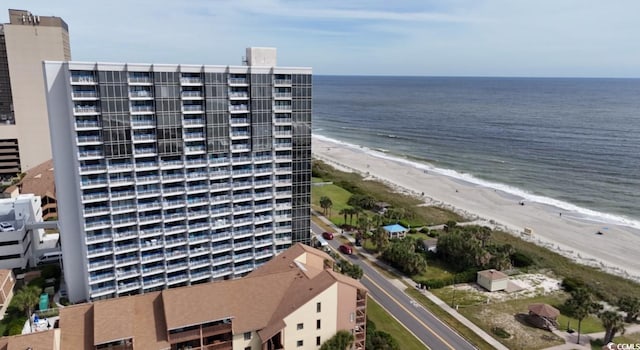 bird's eye view featuring a water view and a view of the beach