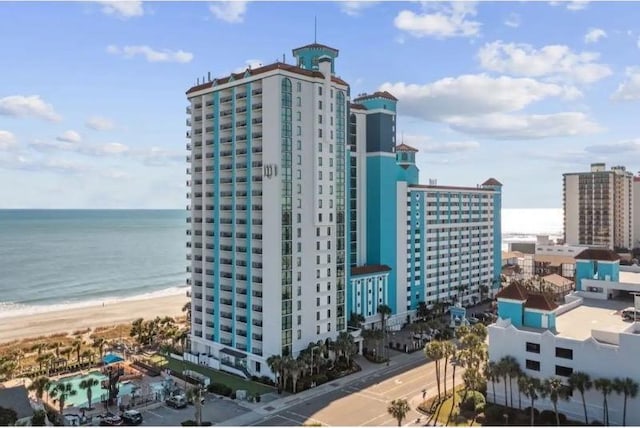 exterior space with a beach view and a water view