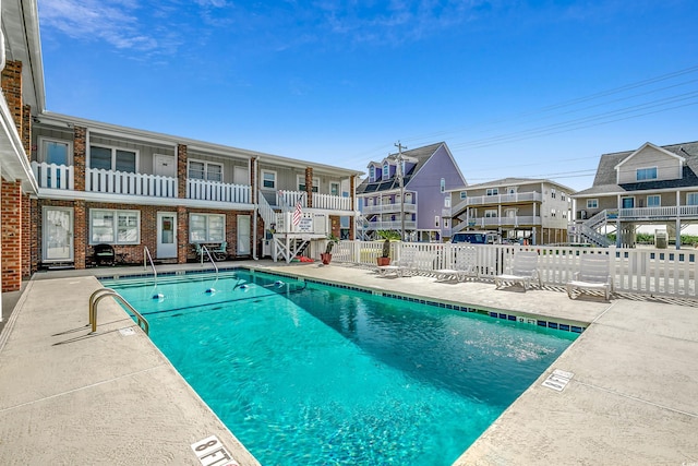 view of swimming pool with a patio