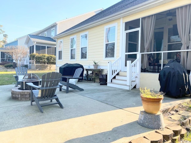 view of patio / terrace featuring area for grilling and a fire pit