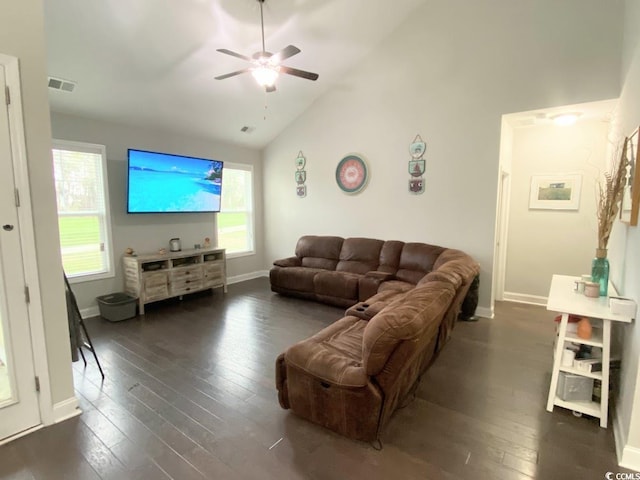 living room featuring dark wood-type flooring, ceiling fan, and high vaulted ceiling