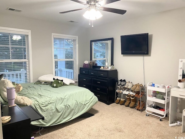 carpeted bedroom featuring ceiling fan