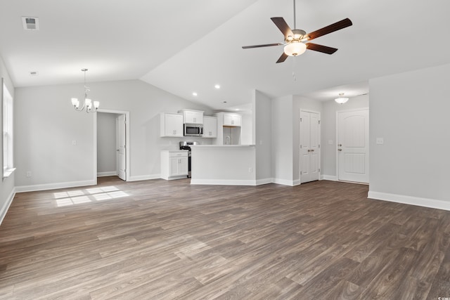 unfurnished living room featuring baseboards, vaulted ceiling, wood finished floors, and ceiling fan with notable chandelier