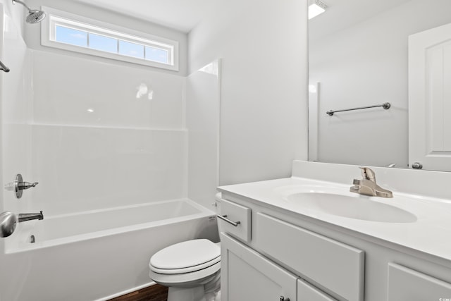 full bathroom featuring visible vents, shower / tub combination, vanity, and toilet