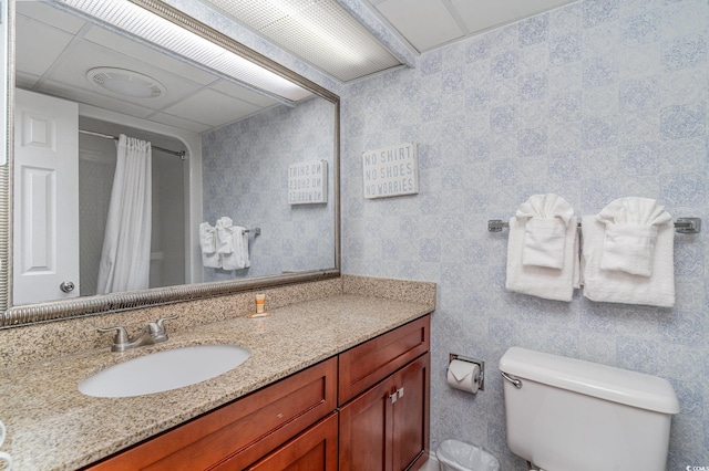 bathroom featuring toilet, a shower with curtain, and vanity