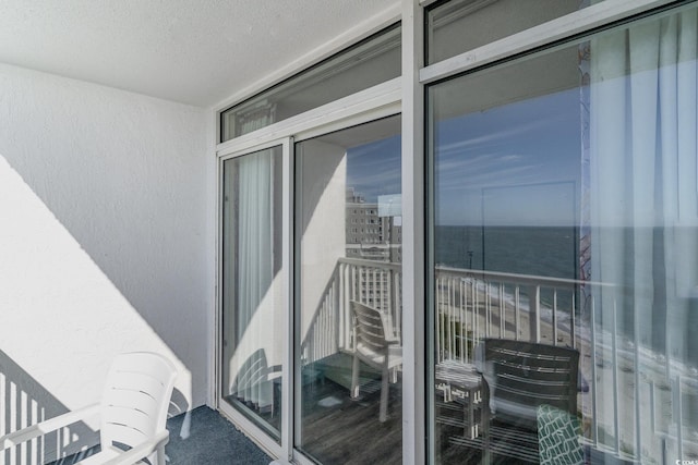 balcony featuring a water view