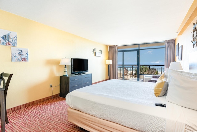 bedroom featuring carpet flooring, access to outside, and floor to ceiling windows