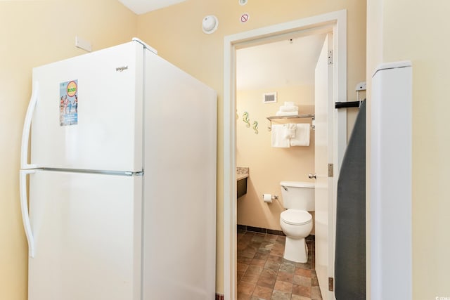 1501 S Ocean Blvd Unit 330, Myrtle Beach, SC 29577 - bathroom with stone finish flooring and toilet
