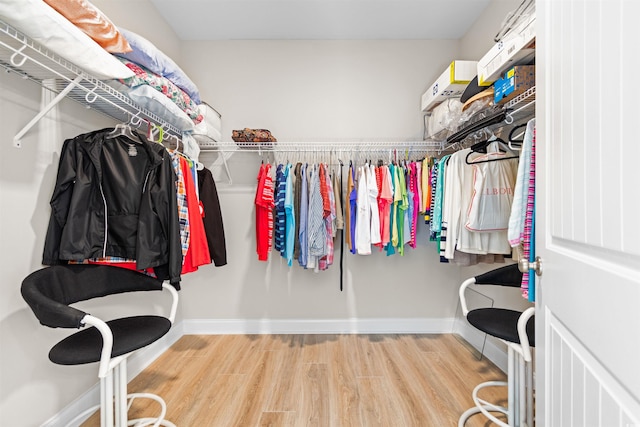 spacious closet featuring hardwood / wood-style floors