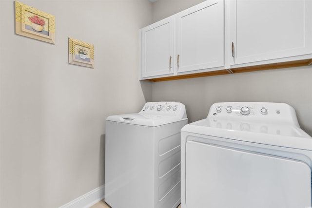 laundry area with cabinets and washer and dryer