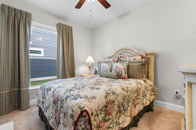 bedroom featuring ceiling fan and light colored carpet