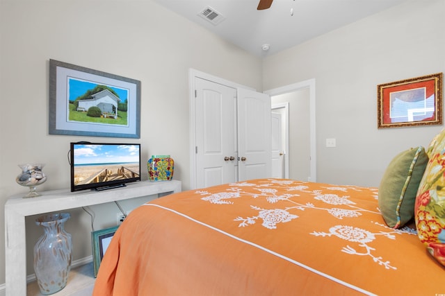 bedroom featuring ceiling fan and a closet