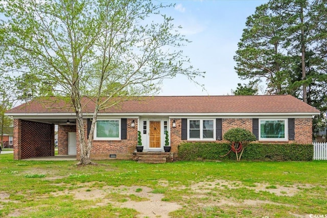 ranch-style home featuring a front lawn and a carport