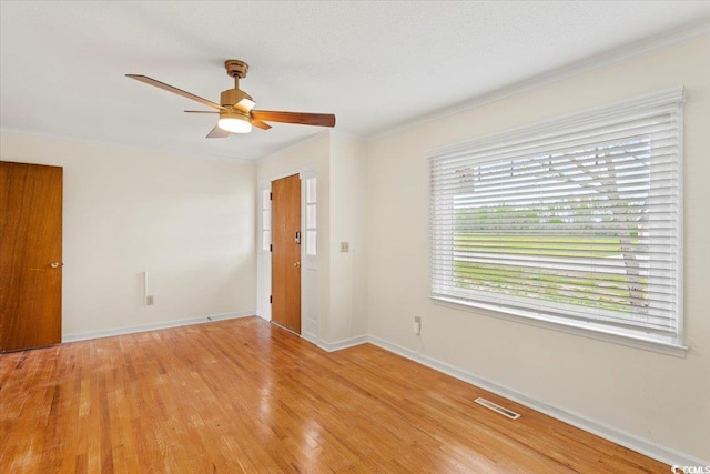 unfurnished room featuring ornamental molding, ceiling fan, and hardwood / wood-style flooring