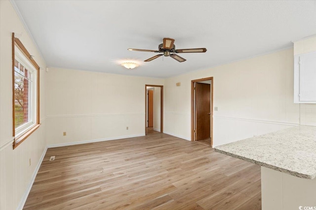 spare room with ceiling fan and light hardwood / wood-style floors