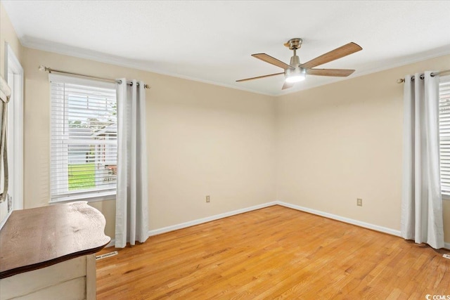 unfurnished bedroom featuring light wood-type flooring, ornamental molding, and ceiling fan