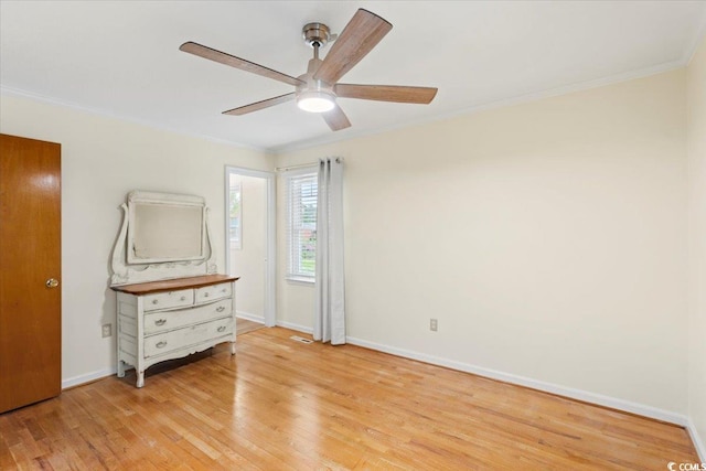 unfurnished bedroom with light wood-type flooring, ornamental molding, and ceiling fan