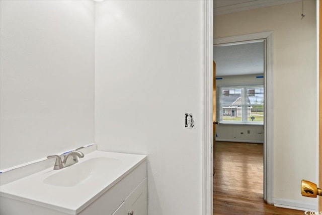 bathroom featuring vanity and hardwood / wood-style floors