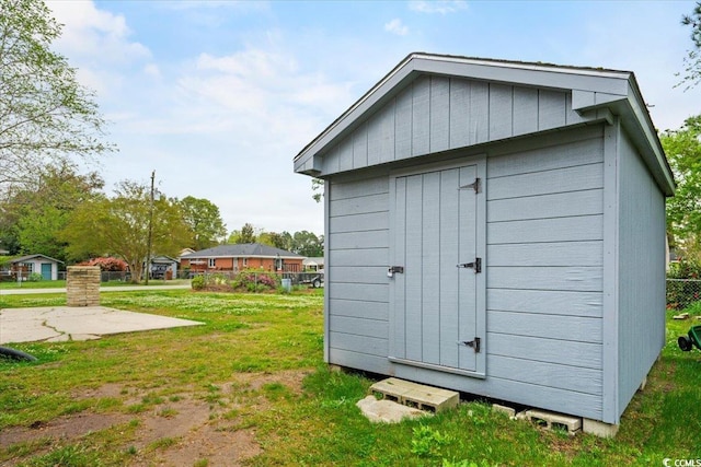 view of outdoor structure with a lawn