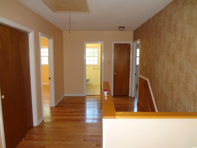 entrance foyer featuring a textured ceiling and light hardwood / wood-style flooring