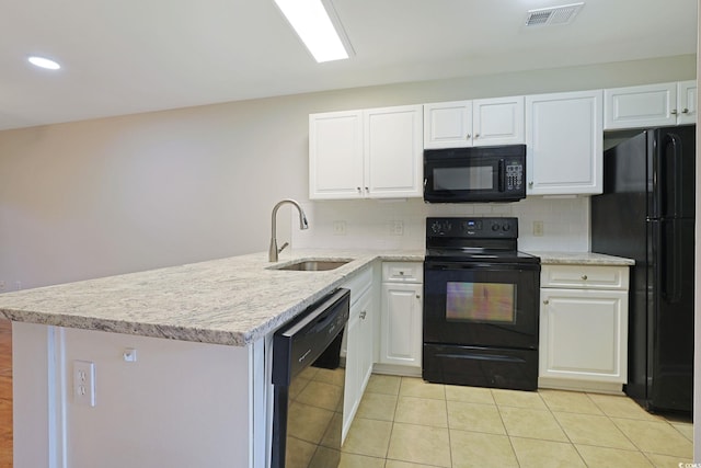 kitchen with black appliances, backsplash, sink, and white cabinets