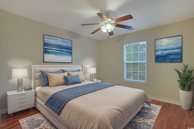 bedroom featuring ceiling fan and dark wood-type flooring